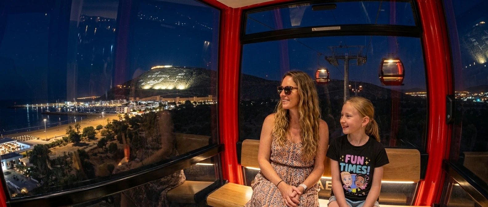 Families enjoying Dania Land Agadir attractions at night